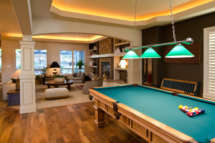 A room along with a pool table and lights